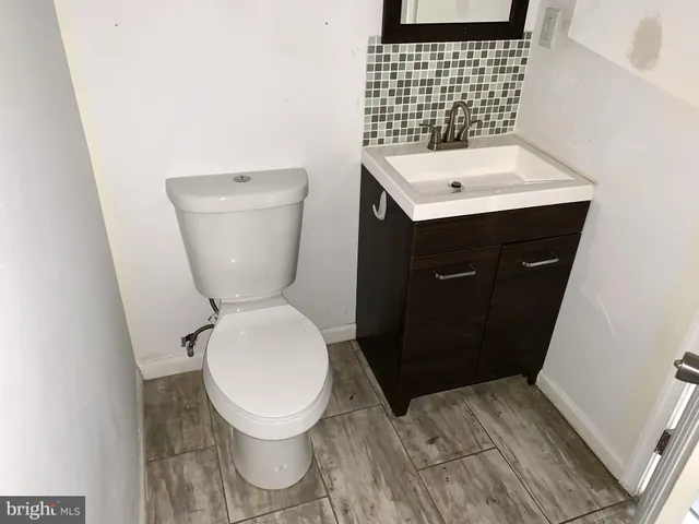 a bathroom with a toilet and a sink