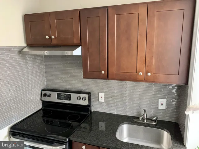 a bathroom with a sink a toilet and vanity