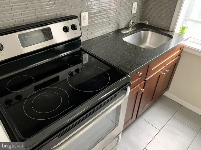 a close view of a sink and a stove