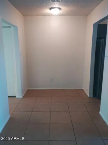 a kitchen with a refrigerator and a sink