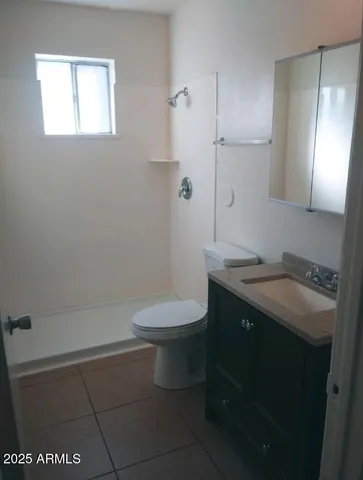 a view of an empty room and a window