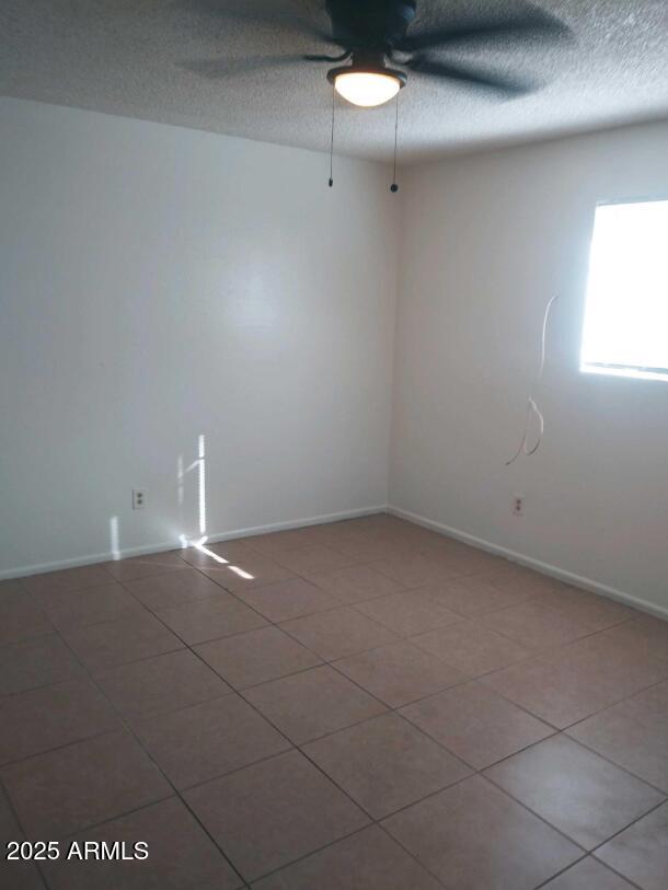 1345 East Campbell Avenue, Unit 7 Phoenix, AZ 85014 - Photo 8 of 9 a view of an empty room and a window