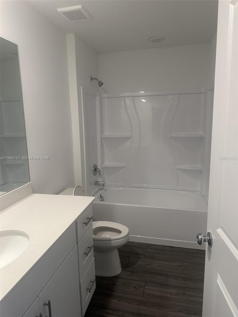 13110 Southwest 89th Street Dunnellon, FL 34432 - Photo 5 of 8 a bathroom with a sink a toilet and shower