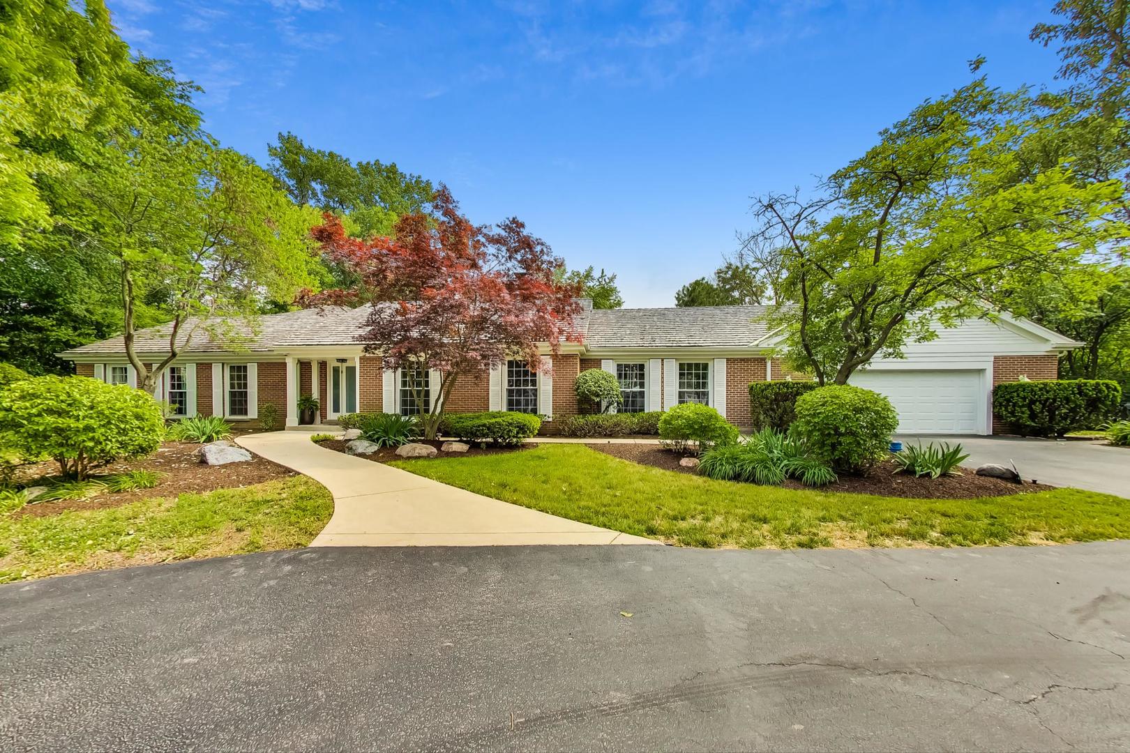 833 Wagner Road Glenview, IL 60025 - Photo 1 of 1 a front view of a house with a yard and potted plants