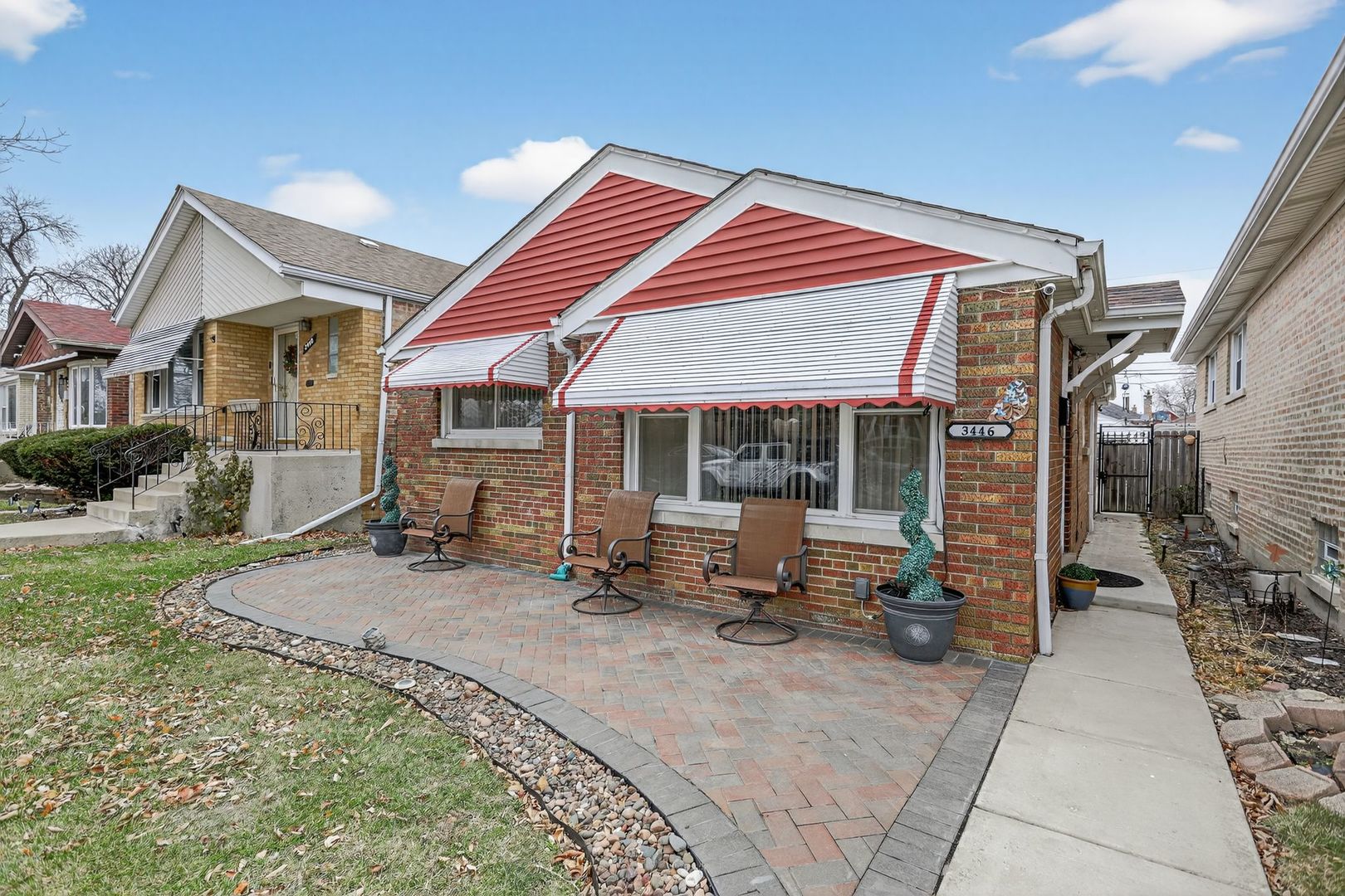 3446 West 74th Street Chicago, IL 60629 - Photo 1 of 30 a backyard of a house with yard and outdoor seating