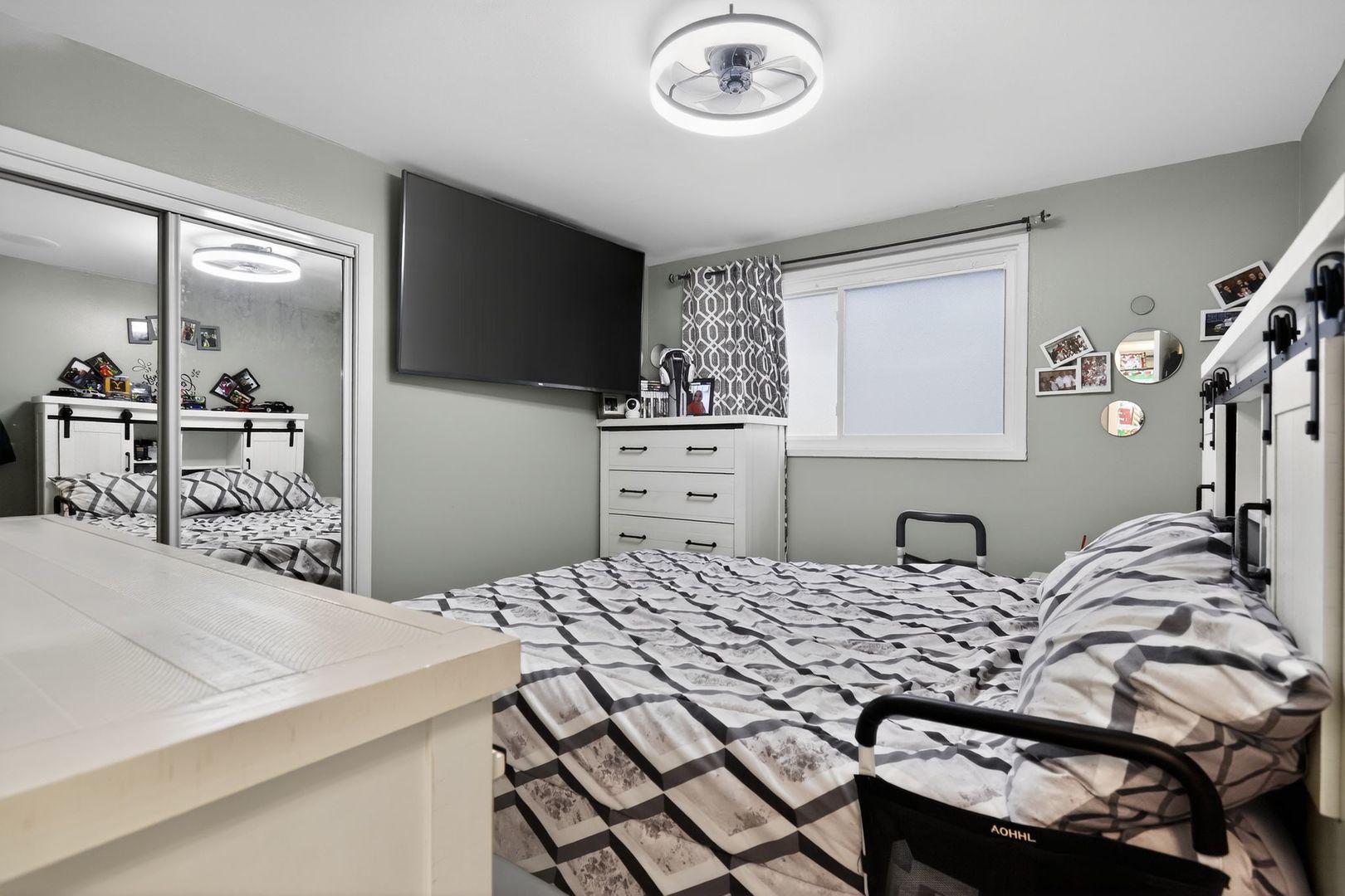 3446 West 74th Street Chicago, IL 60629 - Photo 11 of 30 a bedroom with a bed and a chandelier