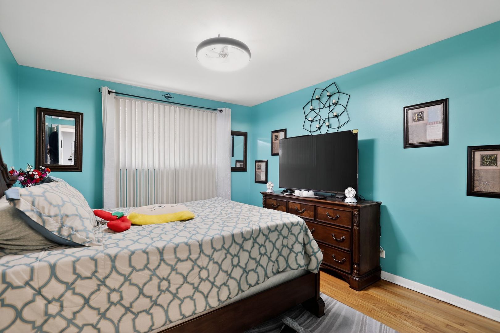 3446 West 74th Street Chicago, IL 60629 - Photo 12 of 30 a bedroom with a bed and a flat screen tv