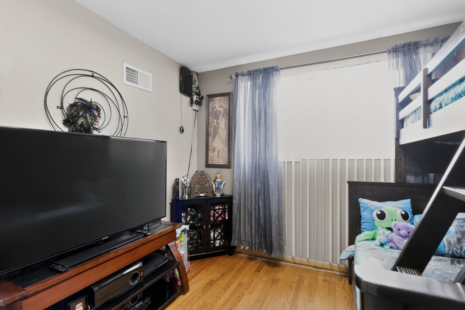 3446 West 74th Street Chicago, IL 60629 - Photo 13 of 30 a living room with furniture and a flat screen tv