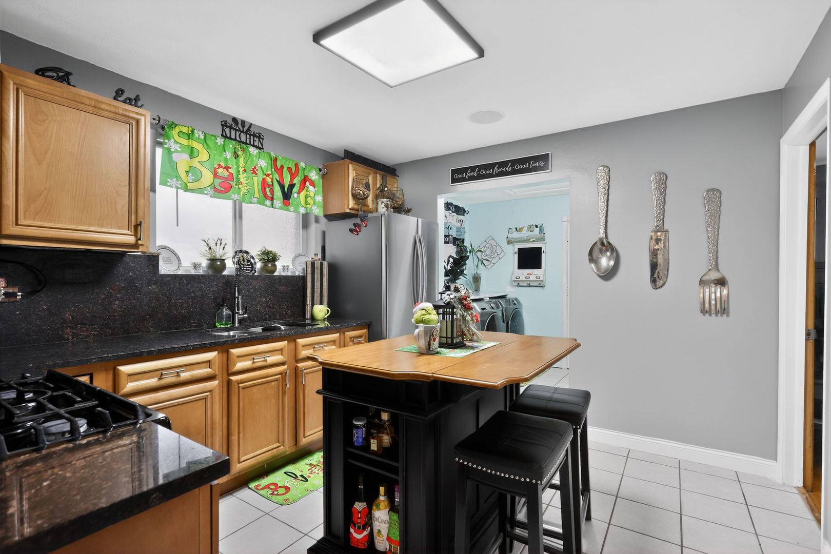 3446 West 74th Street Chicago, IL 60629 - Photo 8 of 30 a kitchen with a sink stove and cabinets