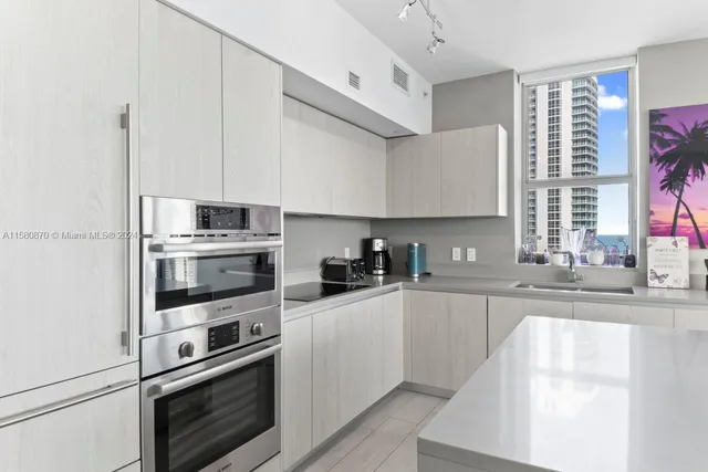a view of a bathroom with a shower and a sink