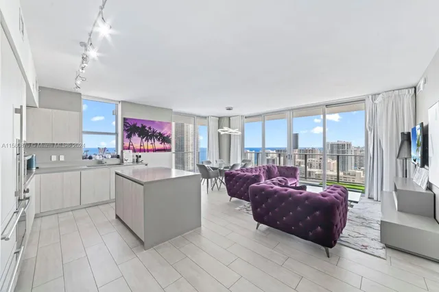 a kitchen with stainless steel appliances kitchen island granite countertop a sink and cabinets