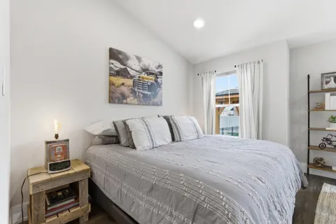 a bedroom with a bed and a tv