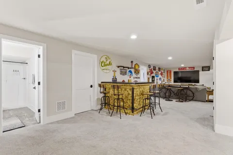 a view of kitchen with furniture and a refrigerator
