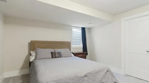 a bathroom with a sink a toilet and shower curtain