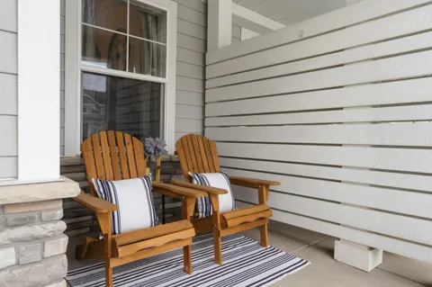 a view of balcony with wooden benches