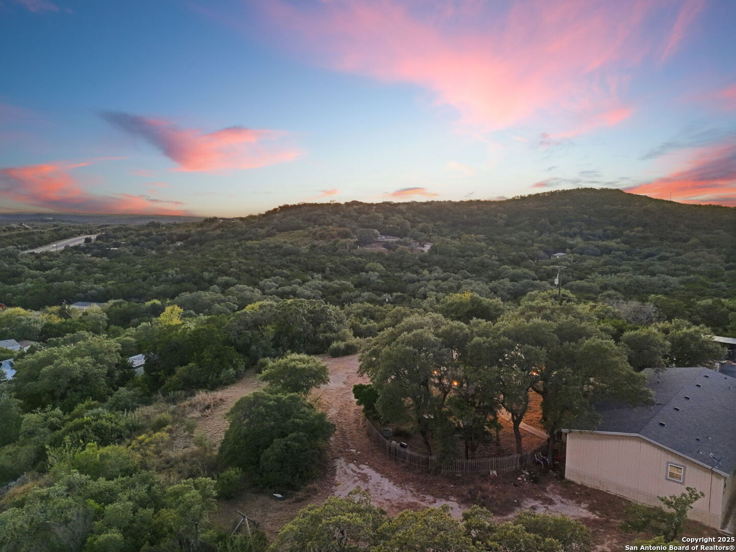 18668 Bandera Road Helotes, TX 78023 - Photo 14 of 52 a view of a city with mountains in the background