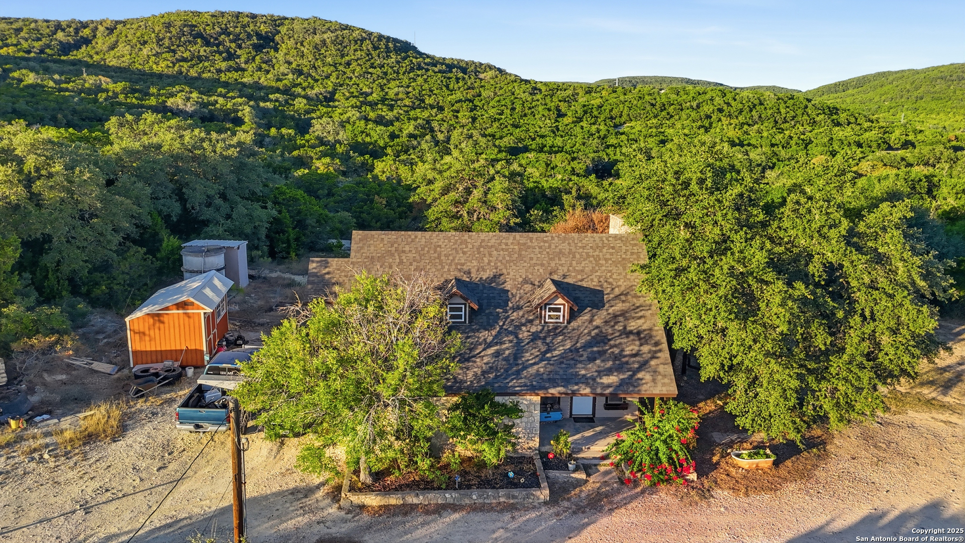 18668 Bandera Road Helotes, TX 78023 - Photo 19 of 52 an aerial view of a house with garden space and outdoor seating