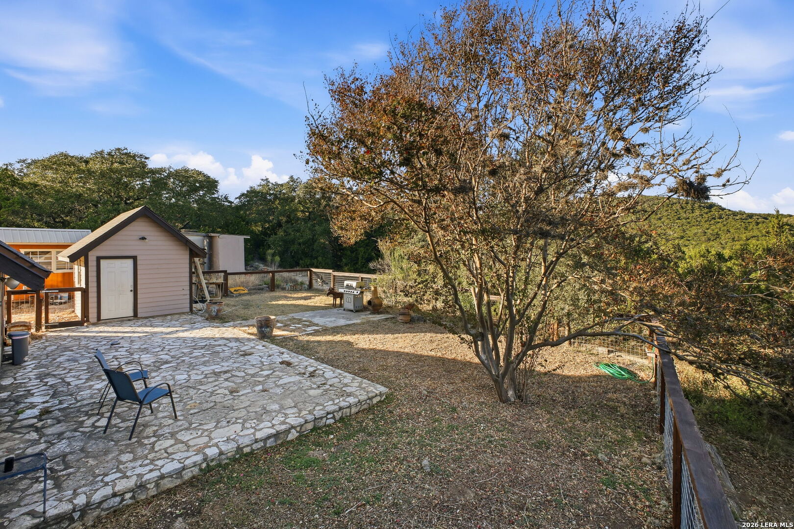 18668 Bandera Road Helotes, TX 78023 - Photo 23 of 52 a front view of a house with garden