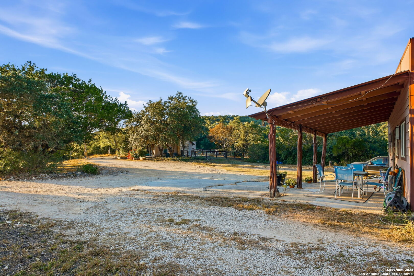 18668 Bandera Road Helotes, TX 78023 - Photo 27 of 52 a view of a swimming pool with a patio