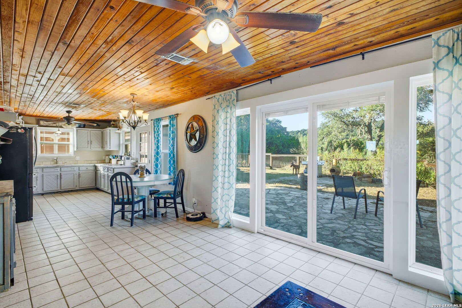 18668 Bandera Road Helotes, TX 78023 - Photo 42 of 52 a view of living room kitchen with furniture and outdoor seating