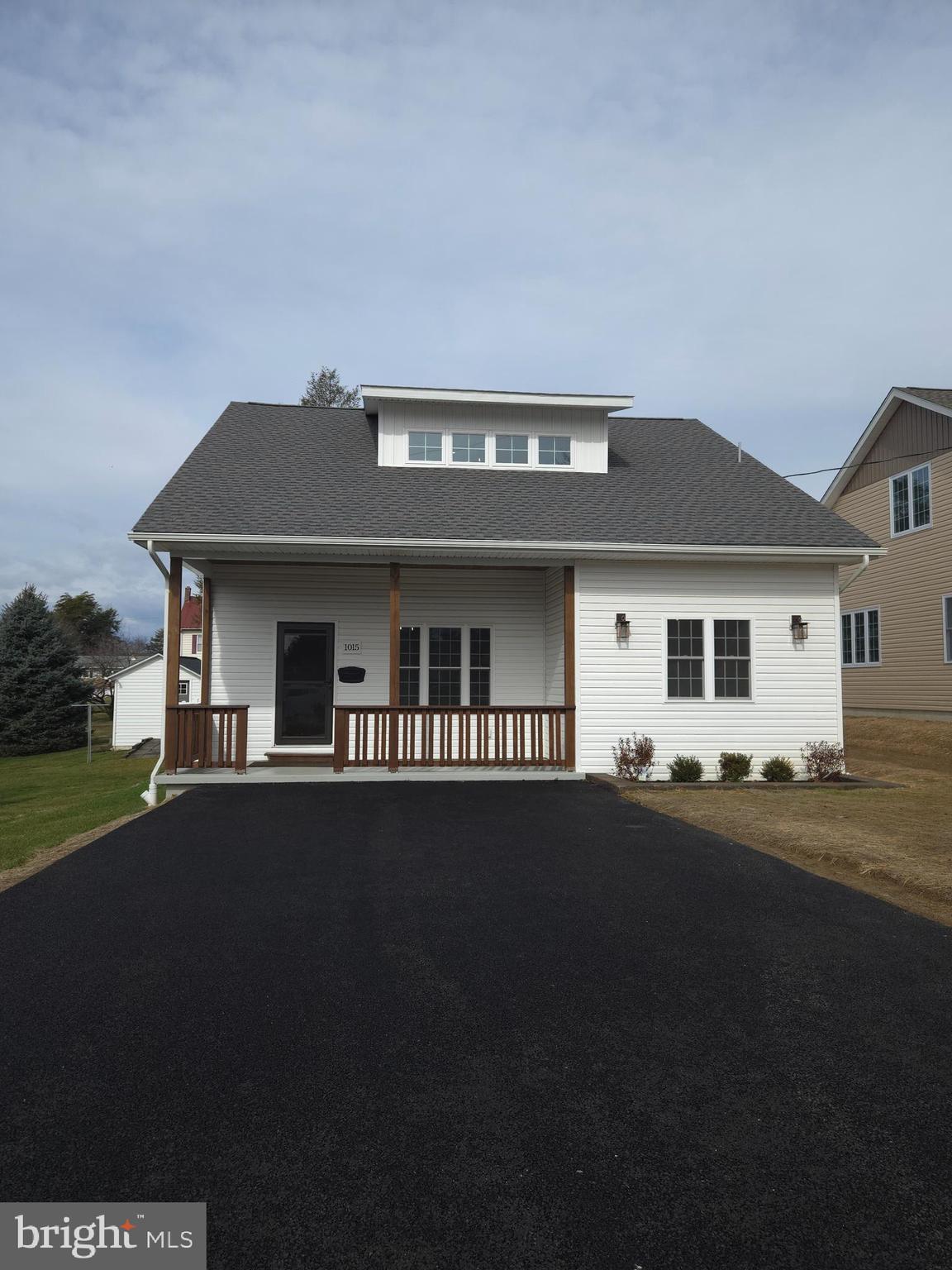 1015 Chambers Street Harrisburg, PA 17113 - Photo 1 of 23 a front view of a house with a garden