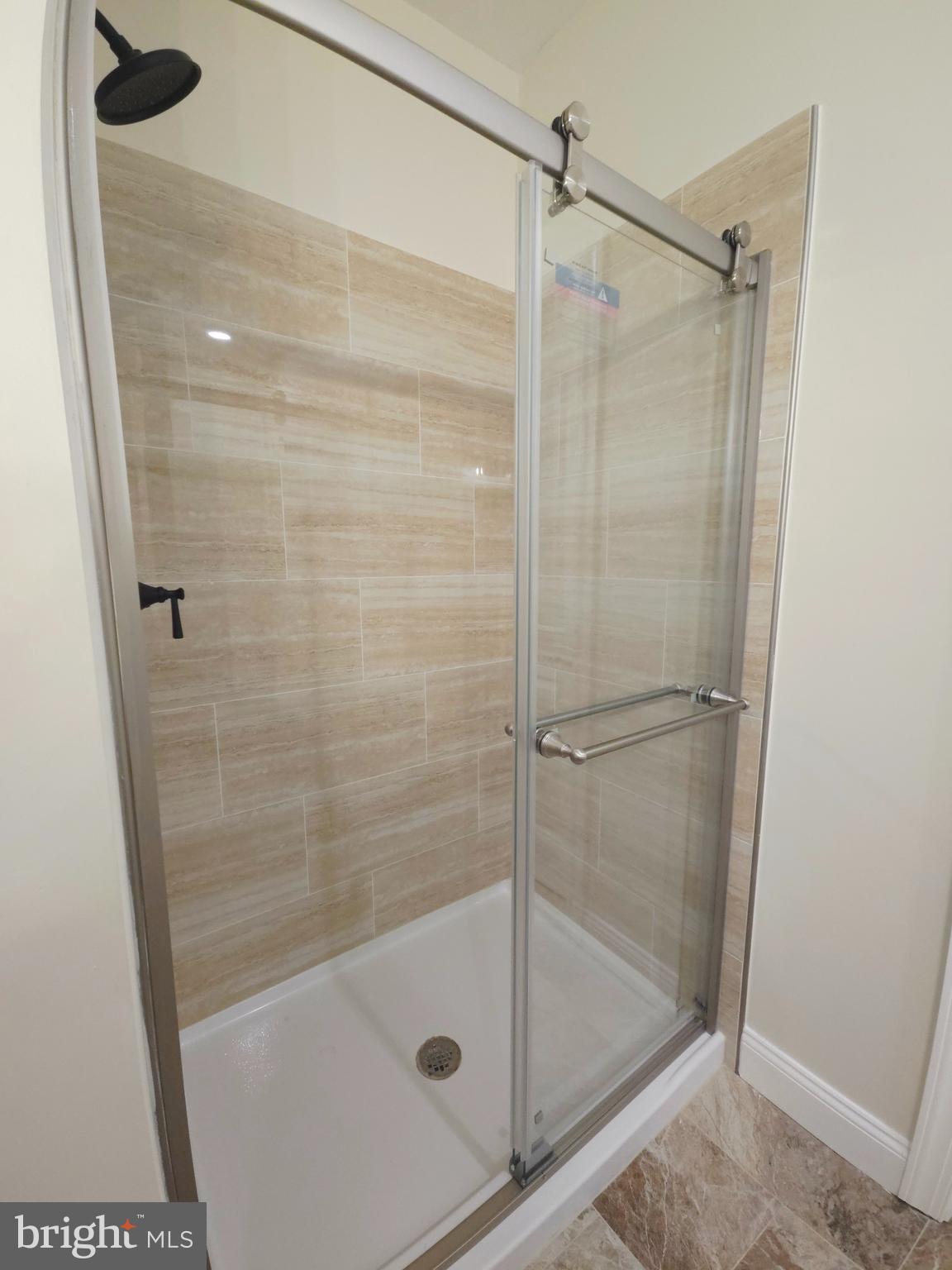 1015 Chambers Street Harrisburg, PA 17113 - Photo 11 of 23 a bathroom with a glass shower door