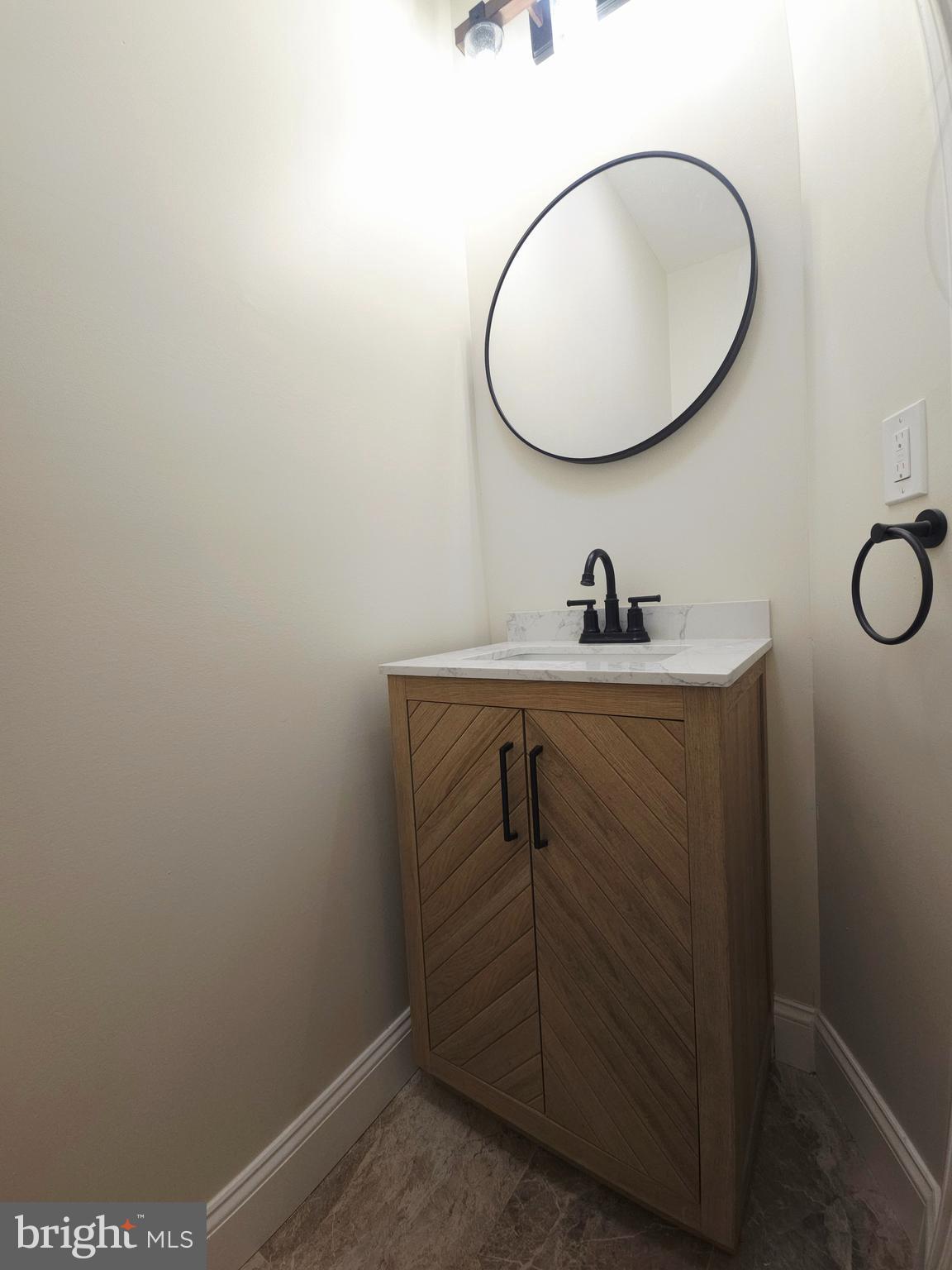 1015 Chambers Street Harrisburg, PA 17113 - Photo 13 of 23 a bathroom with a sink and mirror