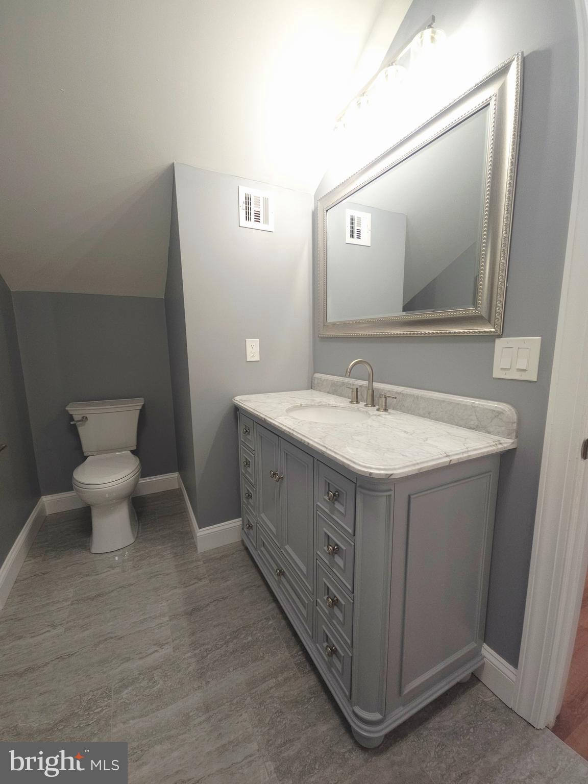1015 Chambers Street Harrisburg, PA 17113 - Photo 17 of 23 a bathroom with a sink toilet and mirror