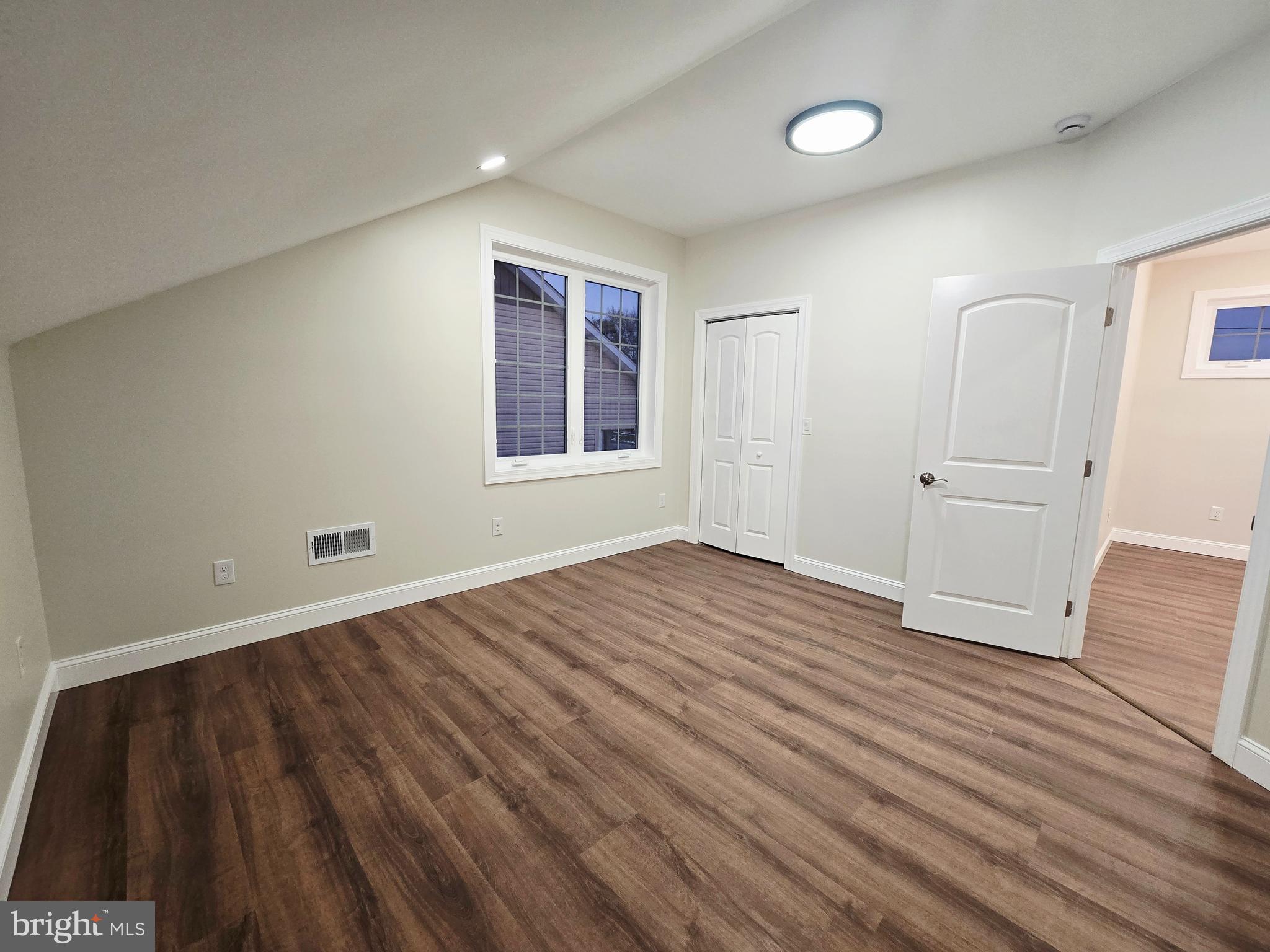 1015 Chambers Street Harrisburg, PA 17113 - Photo 19 of 23 an empty room with wooden floor and windows
