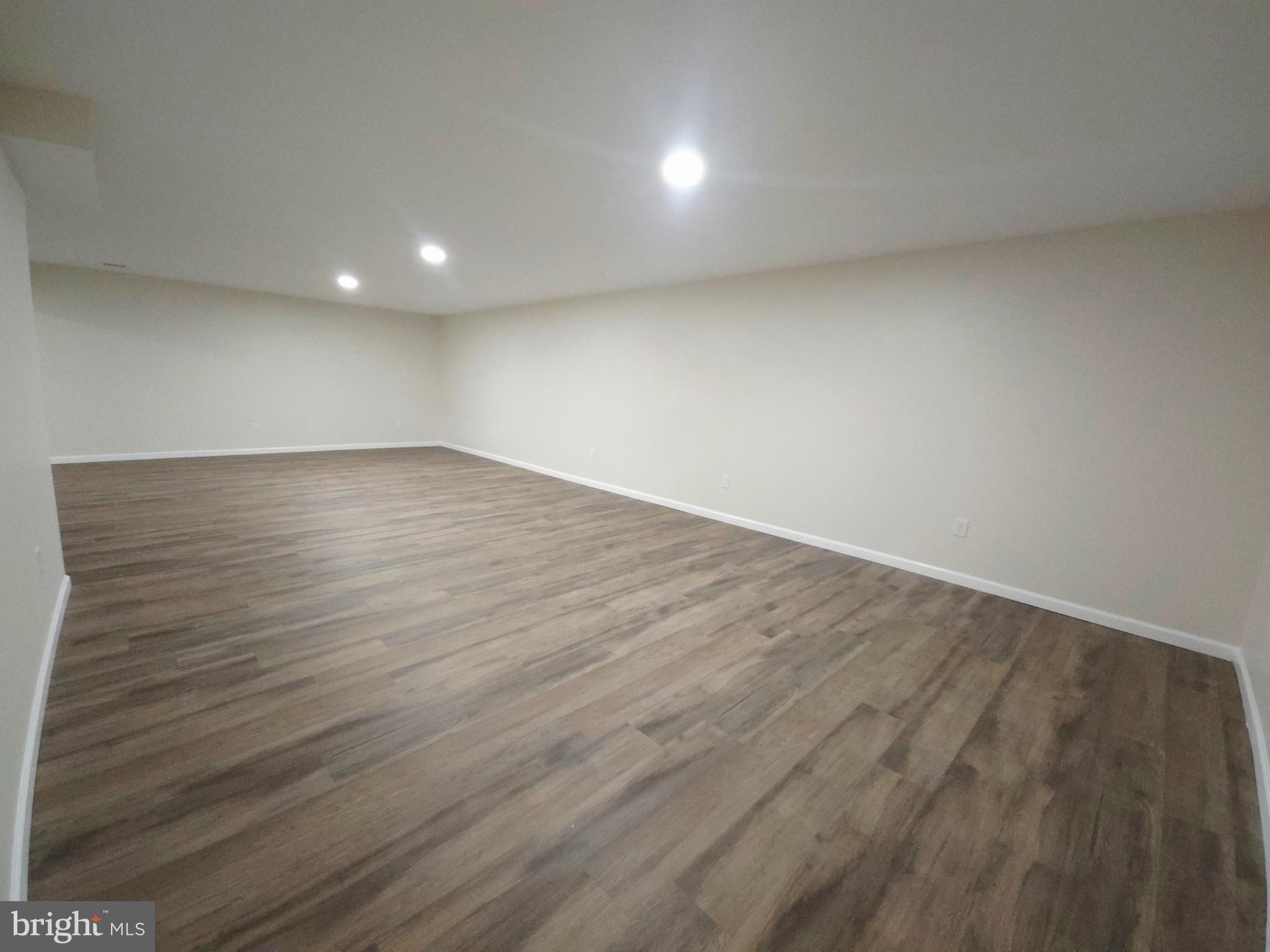 1015 Chambers Street Harrisburg, PA 17113 - Photo 20 of 23 an empty room with wooden floor and windows
