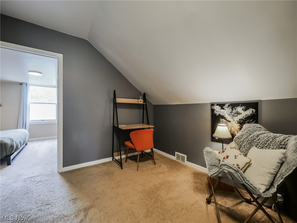 1240 Churchill Road Lyndhurst, OH 44124 - Photo 20 of 30 Living area featuring lofted ceiling and light carpet