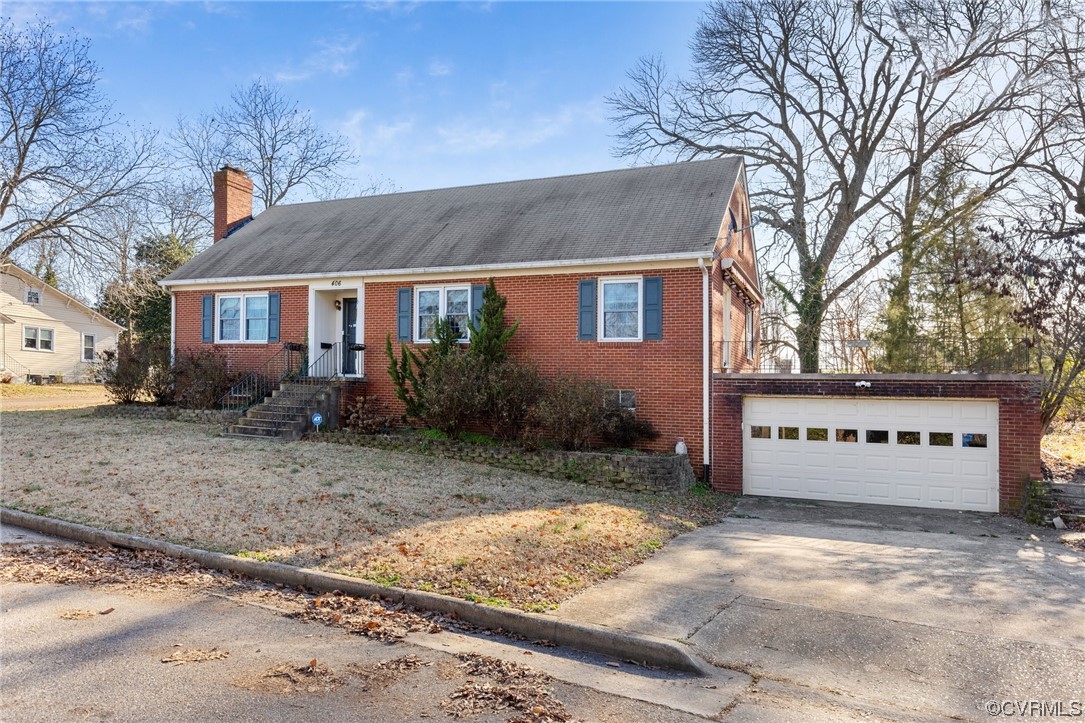 406 Riverside Avenue Hopewell, VA 23860 - Photo 1 of 38 a front view of a house with garden