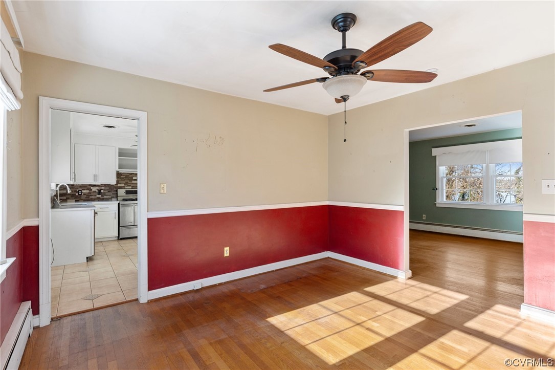 406 Riverside Avenue Hopewell, VA 23860 - Photo 11 of 38 a kitchen with stainless steel appliances kitchen island granite countertop a stove a refrigerator and a microwave