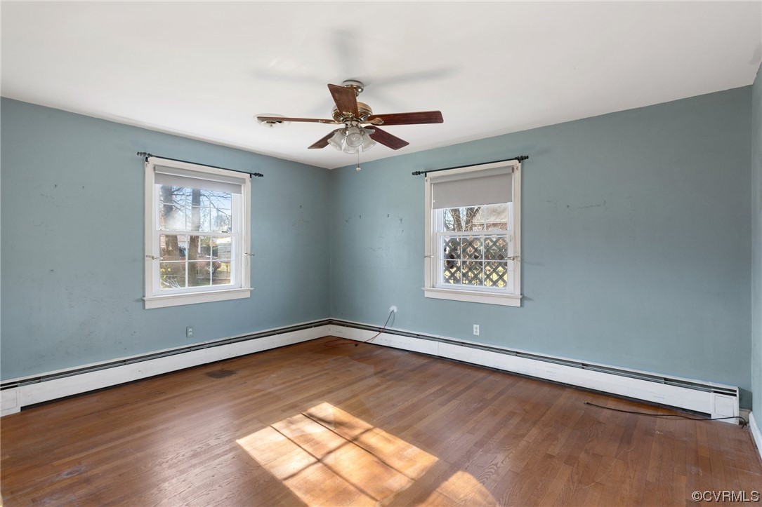406 Riverside Avenue Hopewell, VA 23860 - Photo 16 of 38 a view of room with window ceiling fan and hardwood floor
