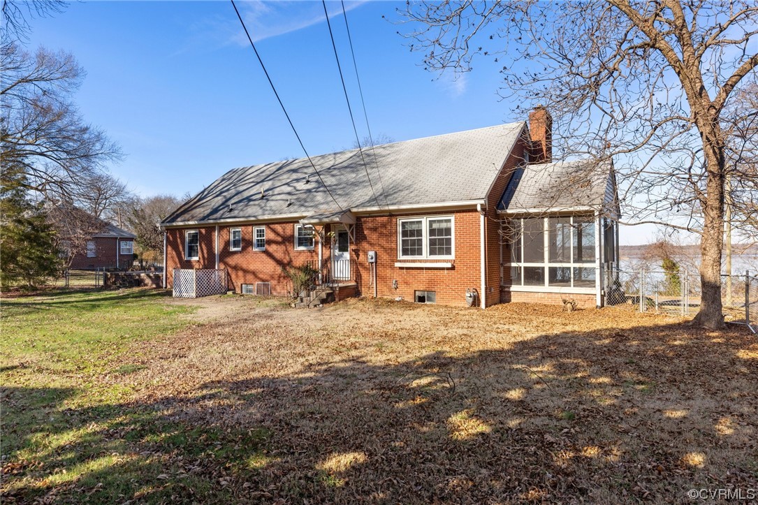 406 Riverside Avenue Hopewell, VA 23860 - Photo 36 of 38 a backyard of a house with large trees and outdoor seating