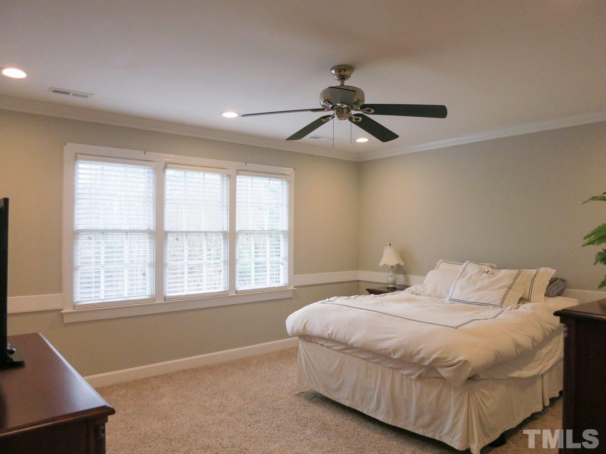 9305 Dawnshire Road Raleigh, NC 27615 - Photo 15 of 25 a bedroom with a large bed and a window