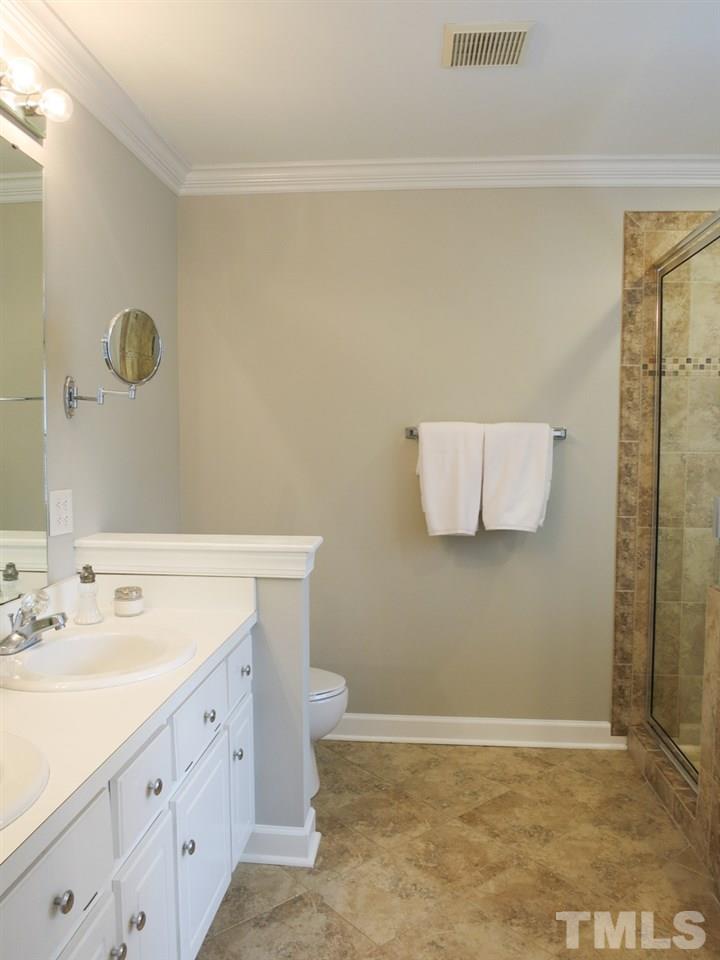 9305 Dawnshire Road Raleigh, NC 27615 - Photo 17 of 25 a bathroom with a sink and a mirror