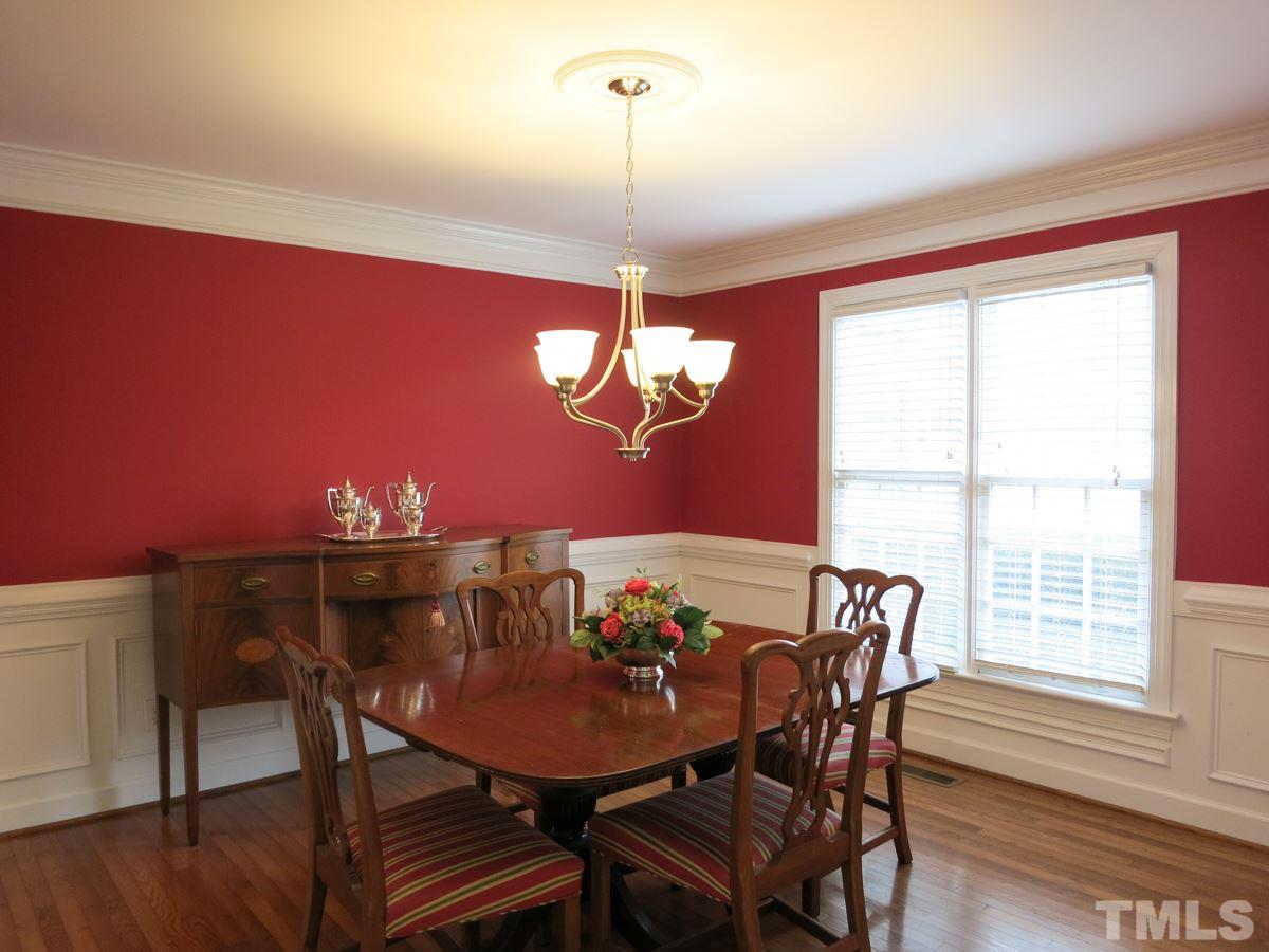 9305 Dawnshire Road Raleigh, NC 27615 - Photo 3 of 25 a view of a dining room with furniture window and wooden floor