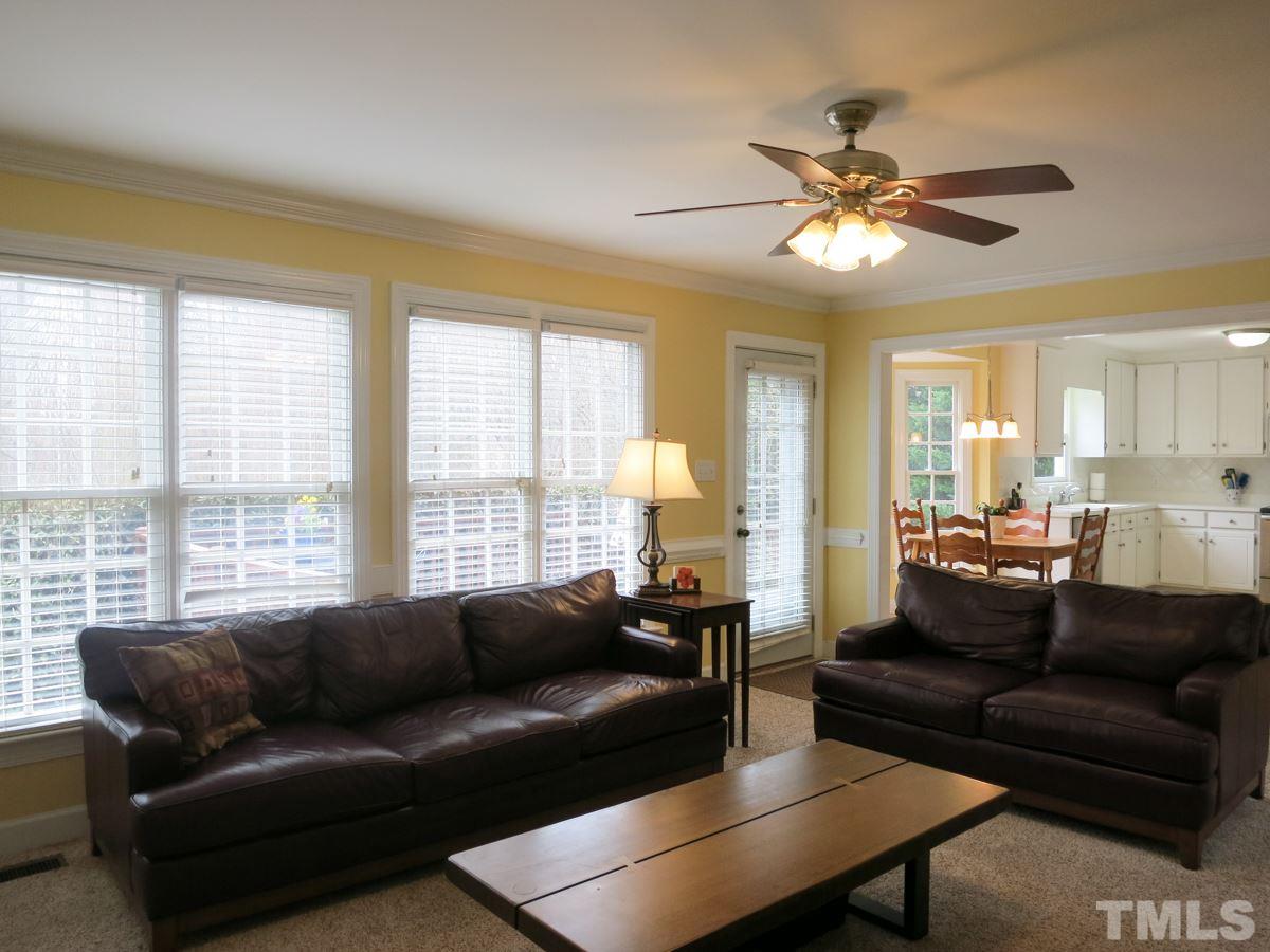 9305 Dawnshire Road Raleigh, NC 27615 - Photo 7 of 25 a living room with furniture and a large window