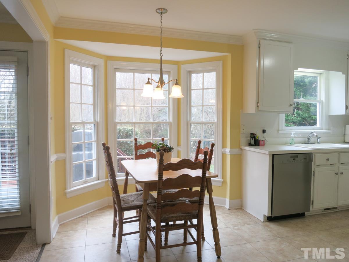 9305 Dawnshire Road Raleigh, NC 27615 - Photo 9 of 25 a view of a dining room with furniture window and outside view