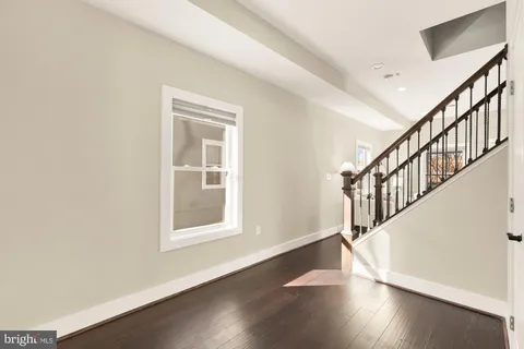 a view of an entryway with wooden floor