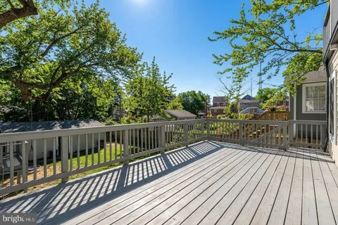 a view of balcony with wooden floor