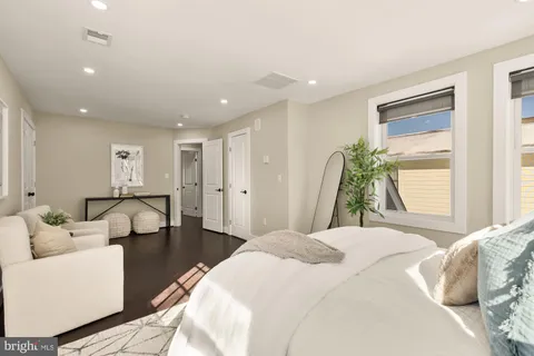 a bedroom with a bed and a couch
