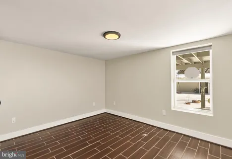a view of livingroom with wooden floor and window