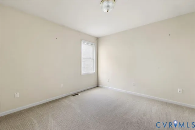 an empty room with a empty space and a window