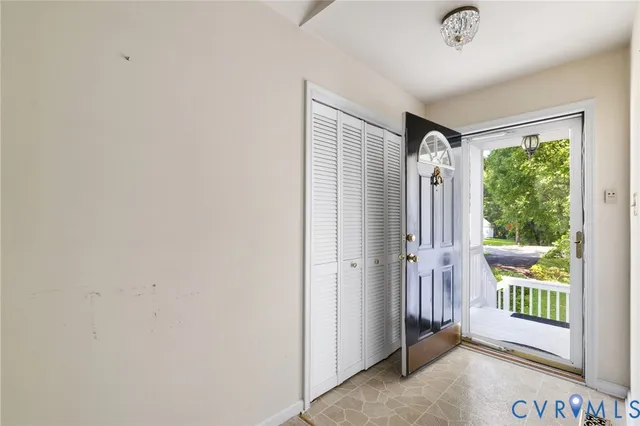 an entryway at the house with a porch