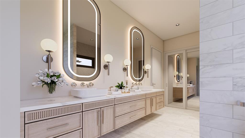 1603 Bay Road Sarasota, FL 34239 - Photo 10 of 13 a spacious bathroom with a double vanity sink and a mirror