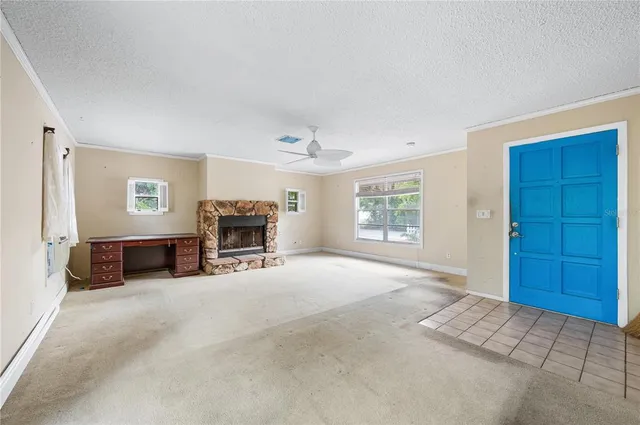 a view of a livingroom with furniture and a window