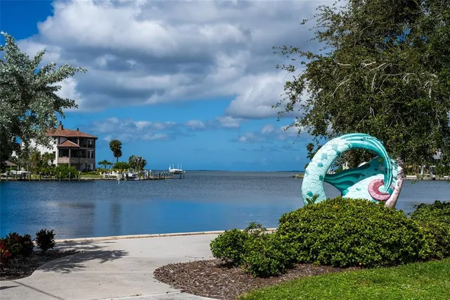 a sign that is on the side of the tree