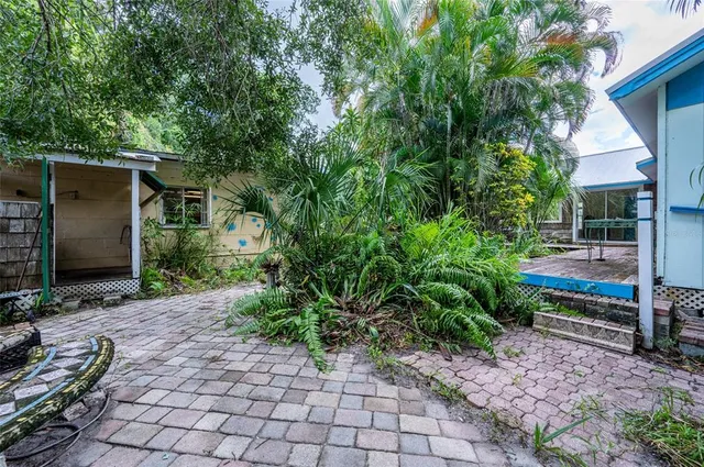 a backyard of a house with seating space